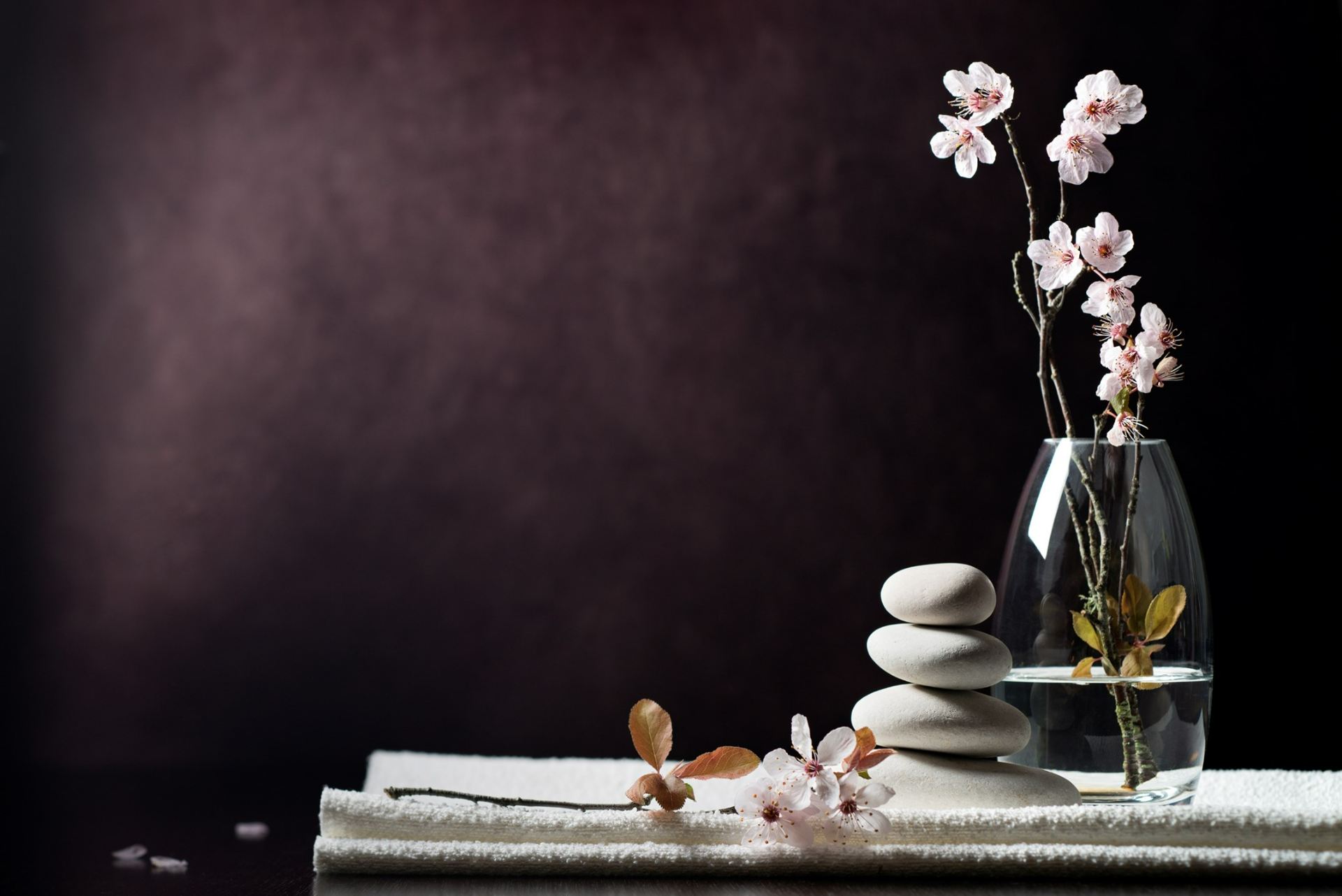 Peaceful setting of stones and cherry blossoms