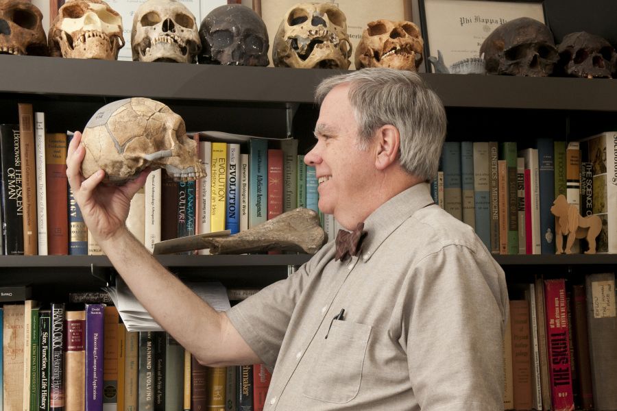 A man holding a skull